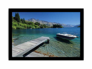 Mountain lake canvas art with dock, boat and clear blue water for modern interiors.
