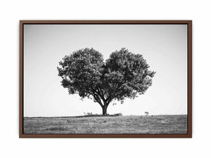 Black and white lone heart-shaped tree canvas art for minimalist room decor.
