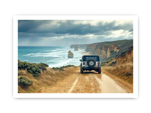 Off-road vehicle on a coastal dirt track overlooking turquoise waves, limestone sea stacks and golden cliffs beneath a cloudy sky