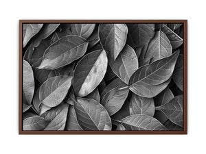Black and white botanical leaves canvas art for calm modern bedroom decor.
