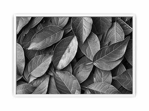 Black and white botanical leaves canvas art for calm modern bedroom decor.