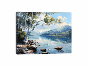 Blue lake landscape canvas art with mountains, trees, and birds for serene living room decor.