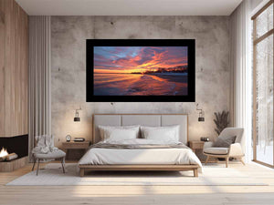 Dramatic coastal sunset canvas art for warm modern living room decor.