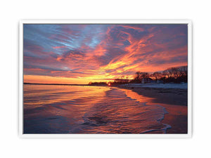 Dramatic coastal sunset canvas art for warm modern living room decor.