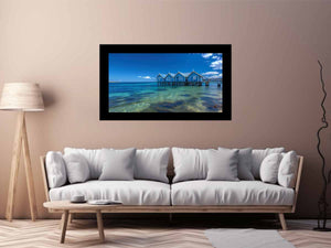 Blue coastal beach hut canvas photography for fresh beach house living room decor.