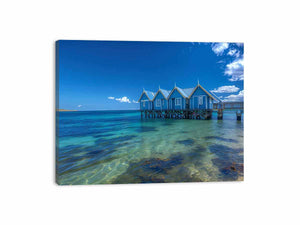 Blue coastal beach hut canvas photography for fresh beach house living room decor.