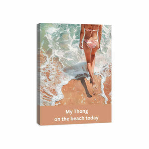 Woman walking on sandy beach with ocean foam and casual text for coastal bathroom decor.