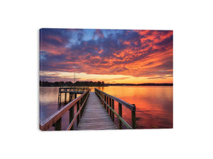 Sunset jetty canvas print with glowing water for modern living room decor.