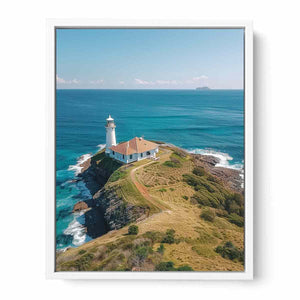 Coastal lighthouse canvas art with turquoise ocean for beach house living room decor.