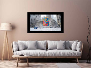 City architecture canvas print with colorful mural on snowy building for modern office decor.