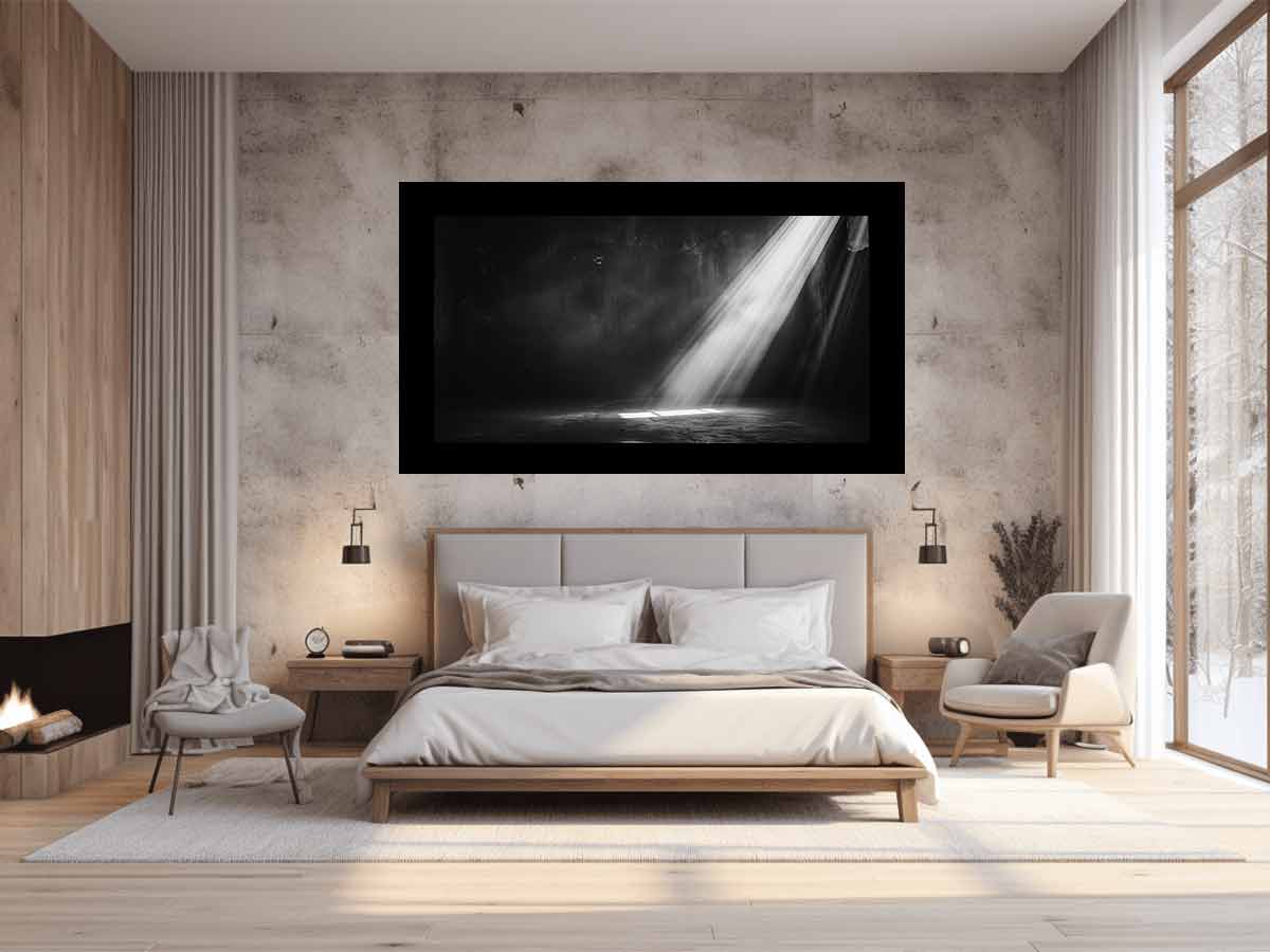Dramatic black and white light beam entering a dark industrial room for modern living rooms decor.