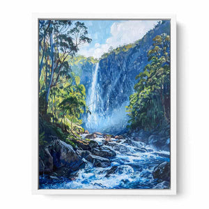 Lush forest waterfall flowing through rocky blue mountain stream for modern living rooms decor.