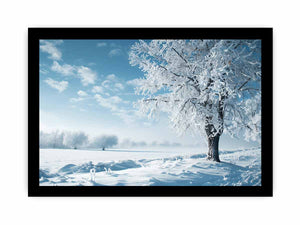 Snowy winter tree landscape canvas art for serene blue and white living room decor.