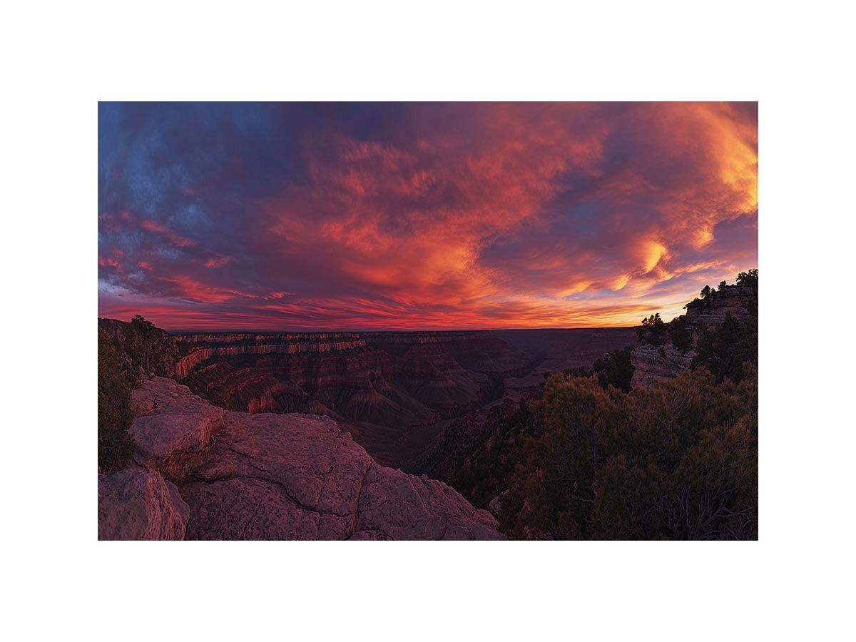 Dramatic red canyon sunset photography for bold modern office wall decor.