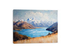 Blue mountain lake canvas art with snowy peaks for refined living room decor.