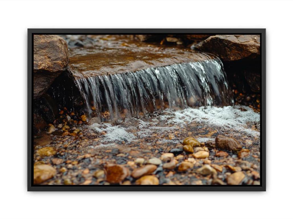 Small creek waterfall photography canvas with rocks and pebbles for peaceful bathroom wall decor.