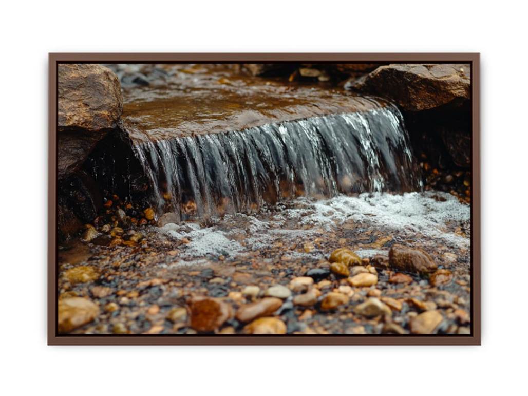 Small creek waterfall photography canvas with rocks and pebbles for peaceful bathroom wall decor.