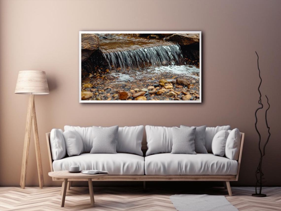 Small creek waterfall photography canvas with rocks and pebbles for peaceful bathroom wall decor.