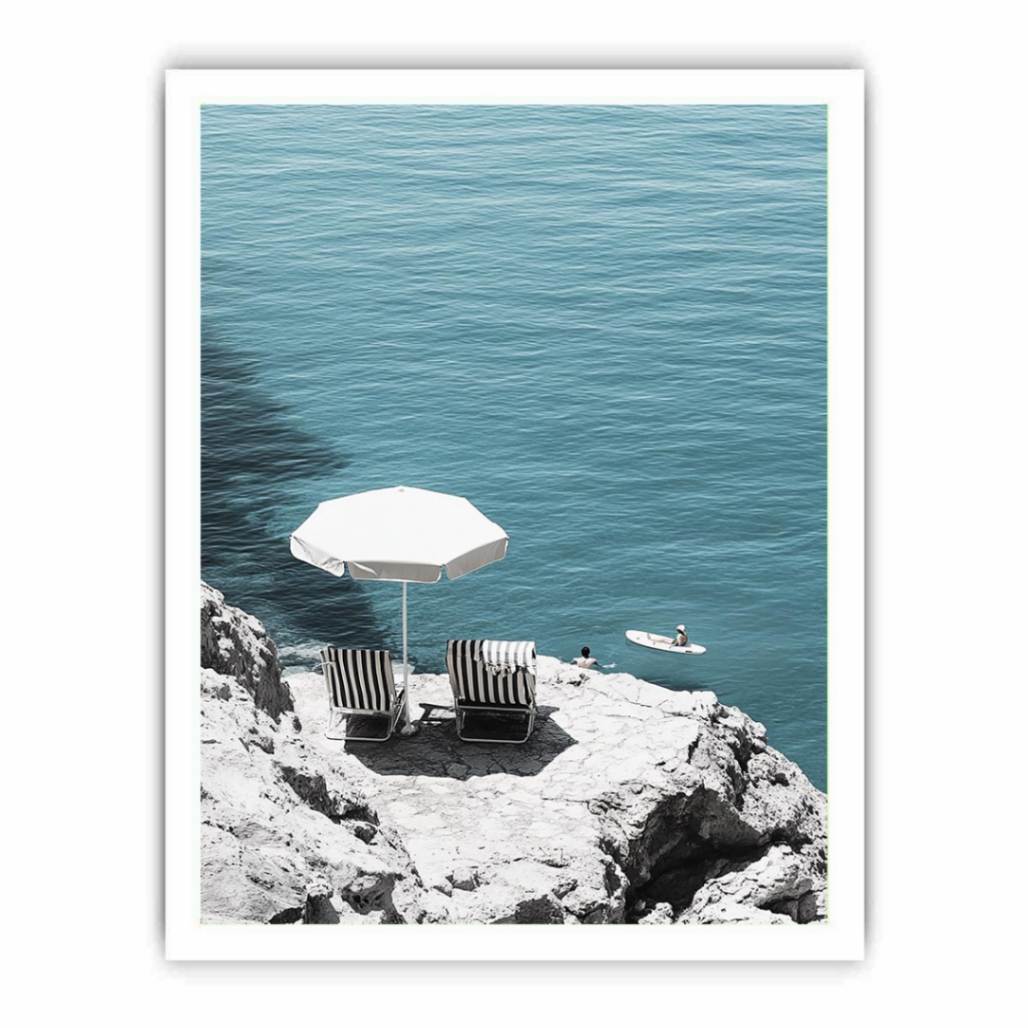 Coastal chairs overlooking calm sea for luxury beach house decor