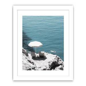Coastal chairs overlooking calm sea for luxury beach house decor