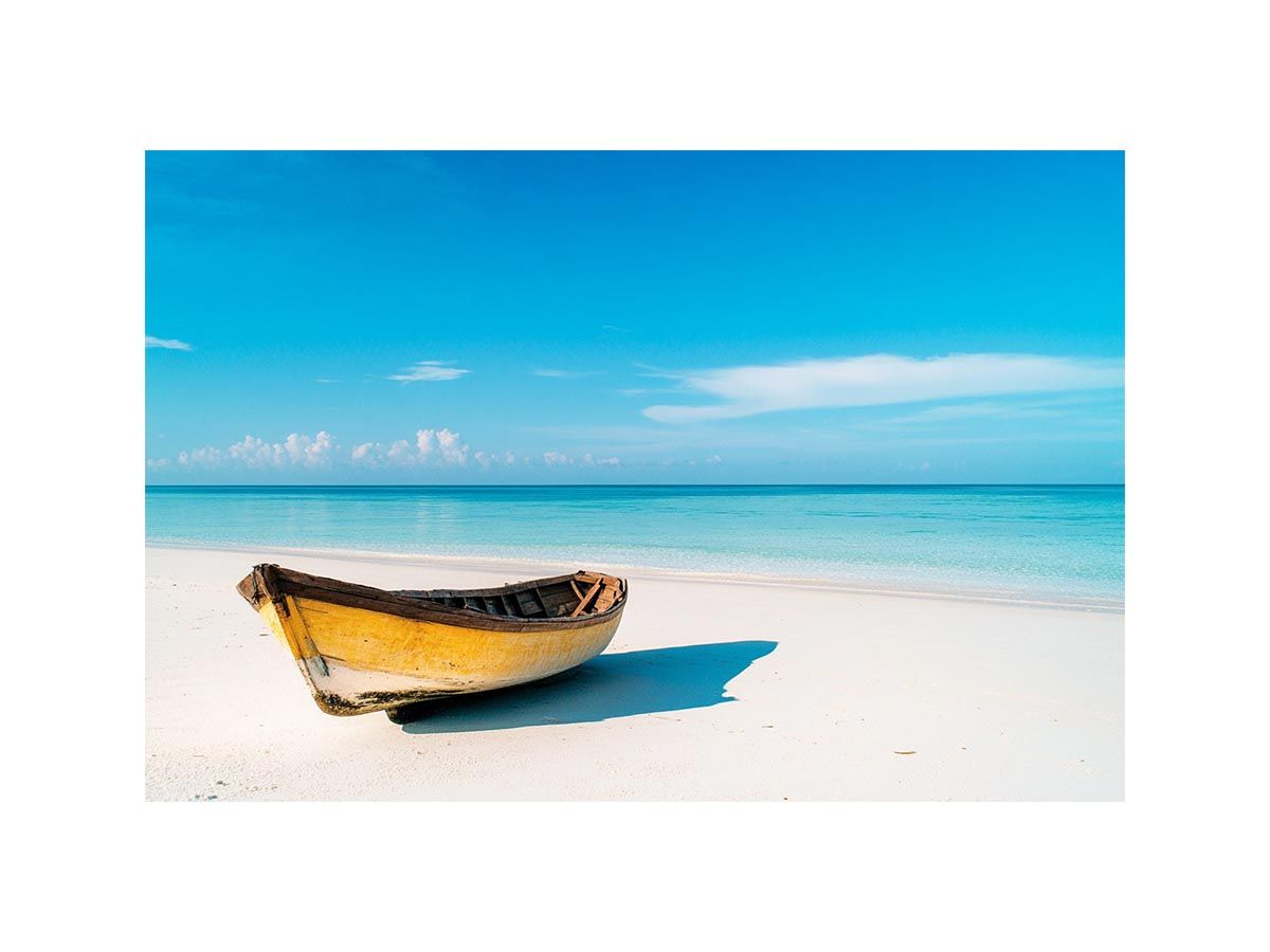 Yellow boat on a pristine beach artwork for coastal home and beach house decor.