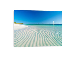 Tropical shoreline with sailboat and turquoise water for coastal living room decor