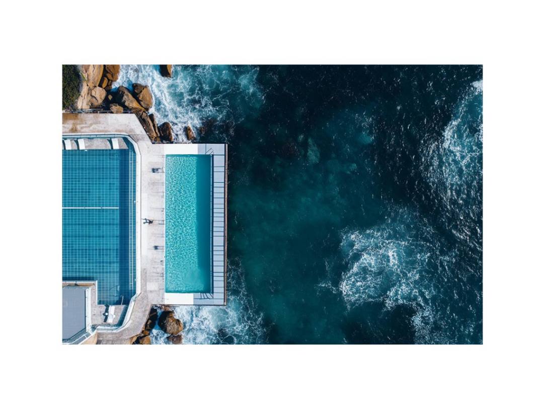 Aerial oceanfront pool photography artwork for modern luxury interior decor