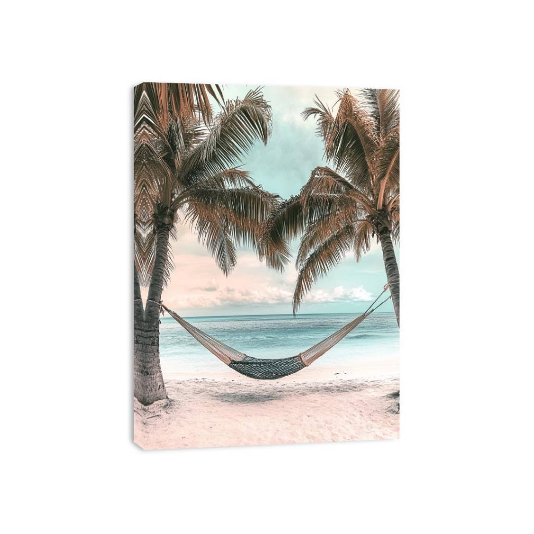 Hammock between palm trees overlooking ocean for peaceful coastal bedroom decor