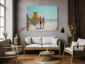 Coastal beach walk canvas art with couple and yellow lifeguard tower for bedroom decor.