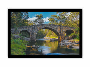 Stone River Crossing a rustic stone bridge spanning a calm river in sunlit woodland