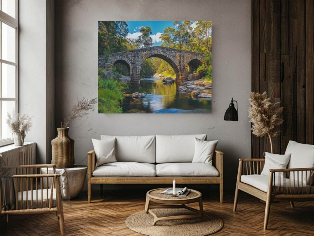 Stone River Crossing a rustic stone bridge spanning a calm river in sunlit woodland