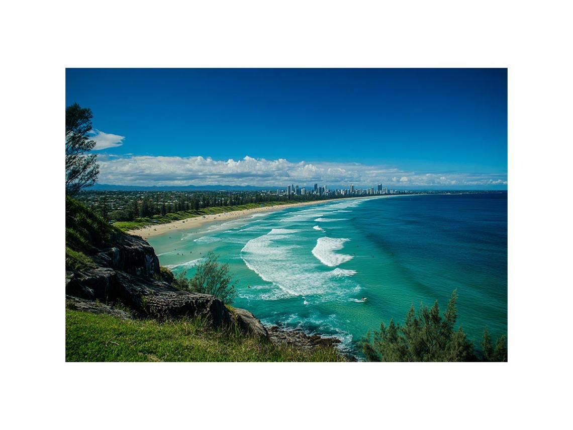Turquoise coastal beach photography canvas art with skyline for modern living room decor.