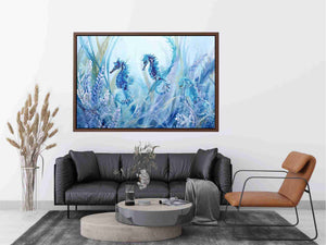 Blue seahorse and starfish canvas art for coastal nursery decor.
