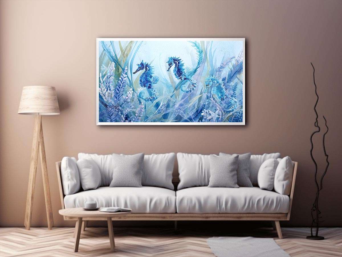 Blue seahorse and starfish canvas art for coastal nursery decor.