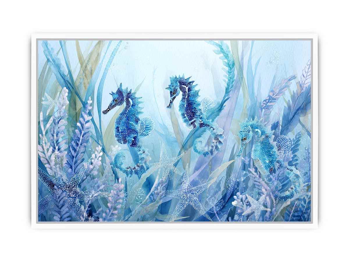 Blue seahorse and starfish canvas art for coastal nursery decor.