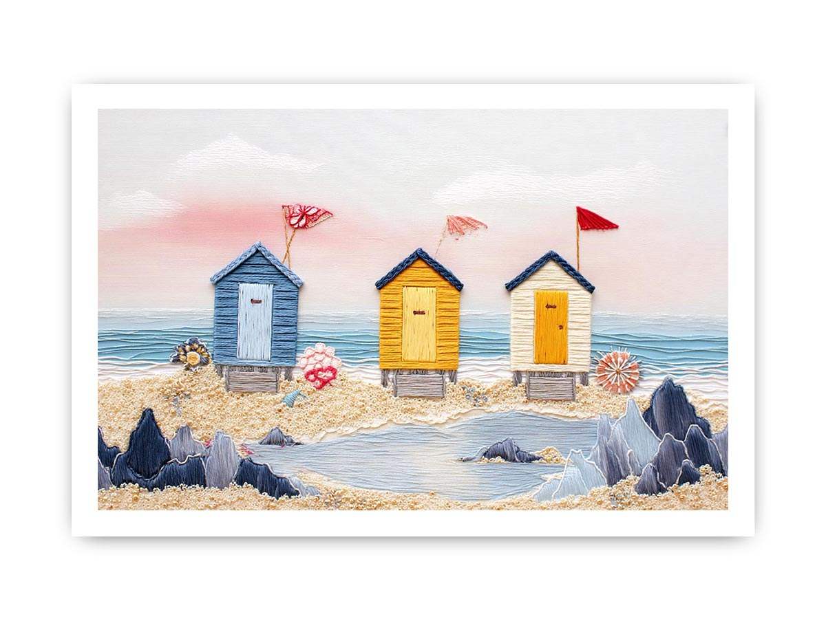 Colorful beach hut canvas art for cute coastal nursery decor.