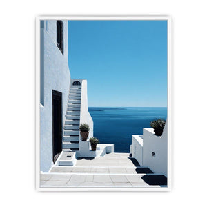 Greek courtyard stairs and sea photography for Mediterranean entryway decor.
