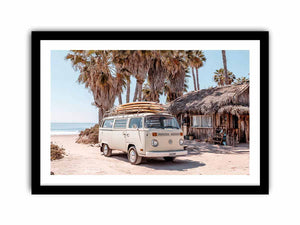 Cream vintage surf van near a palm beach hut for rustic coastal living room decor.