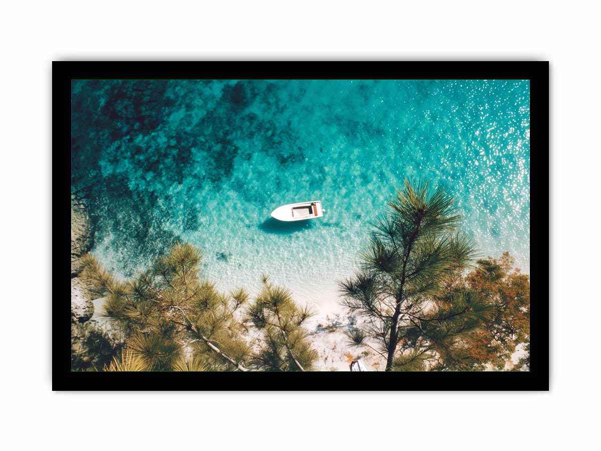 Aerial turquoise cove with white boat and pine trees for calming coastal wall art.
