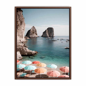 Pastel umbrellas overlooking turquoise sea cliffs for Mediterranean coastal bedroom decor.
