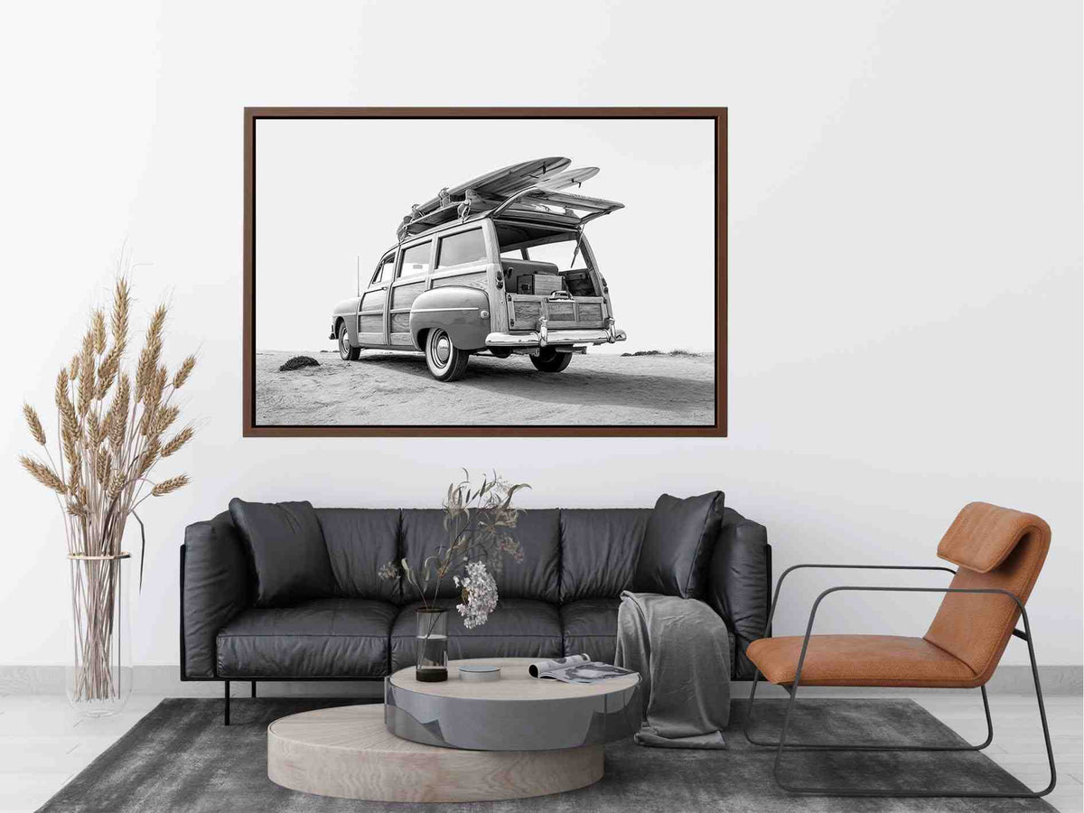 Black and white vintage woody surf wagon with boards for classic coastal wall art.