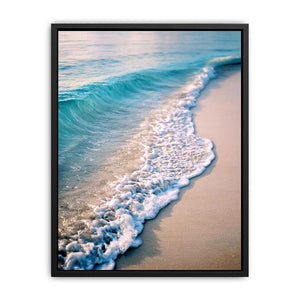 Soft turquoise ocean wave and sandy beach canvas art for coastal living room decor.
