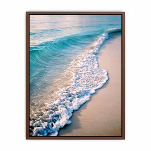 Soft turquoise ocean wave and sandy beach canvas art for coastal living room decor.