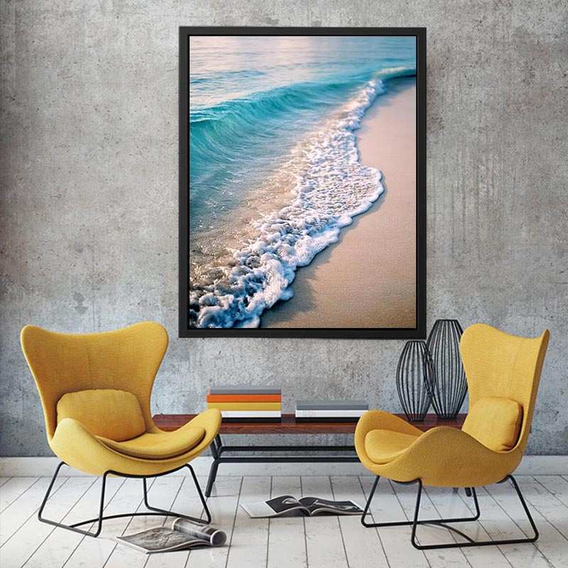 Soft turquoise ocean wave and sandy beach canvas art for coastal living room decor.