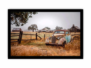 Weathered vintage car and rustic farm canvas art for farmhouse living room decor.