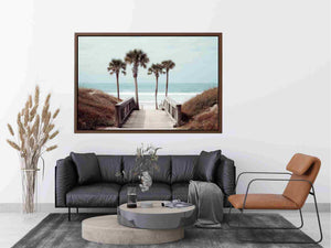 Coastal boardwalk with palm trees and ocean view for relaxed living room decor.