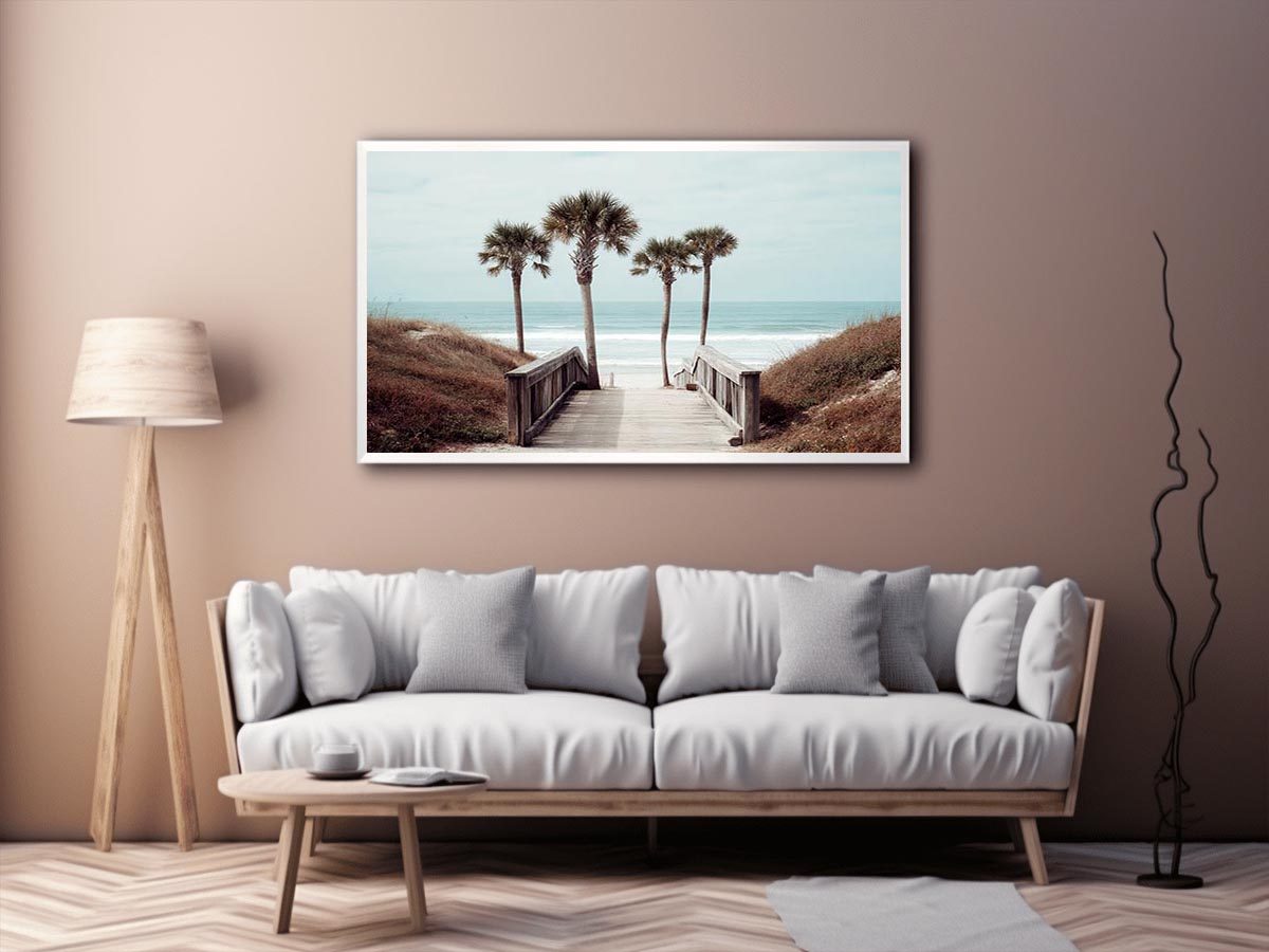 Coastal boardwalk with palm trees and ocean view for relaxed living room decor.