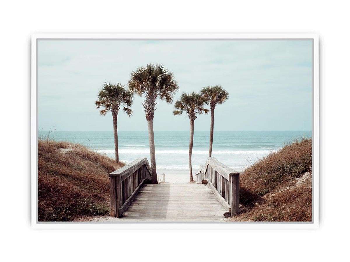 Coastal boardwalk with palm trees and ocean view for relaxed living room decor.