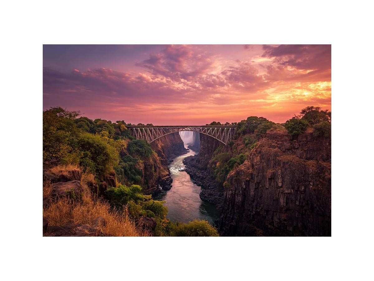 Sunset canyon bridge with river and waterfall for dramatic living room wall decor.
