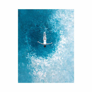 Turquoise ocean swimmer canvas art for coastal bathroom or living room decor.